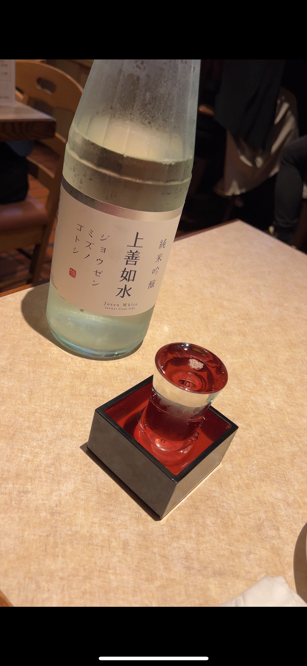 Sake bottle of Jozen Mizunogotoshi with glass poured into a masu box at Ohyama