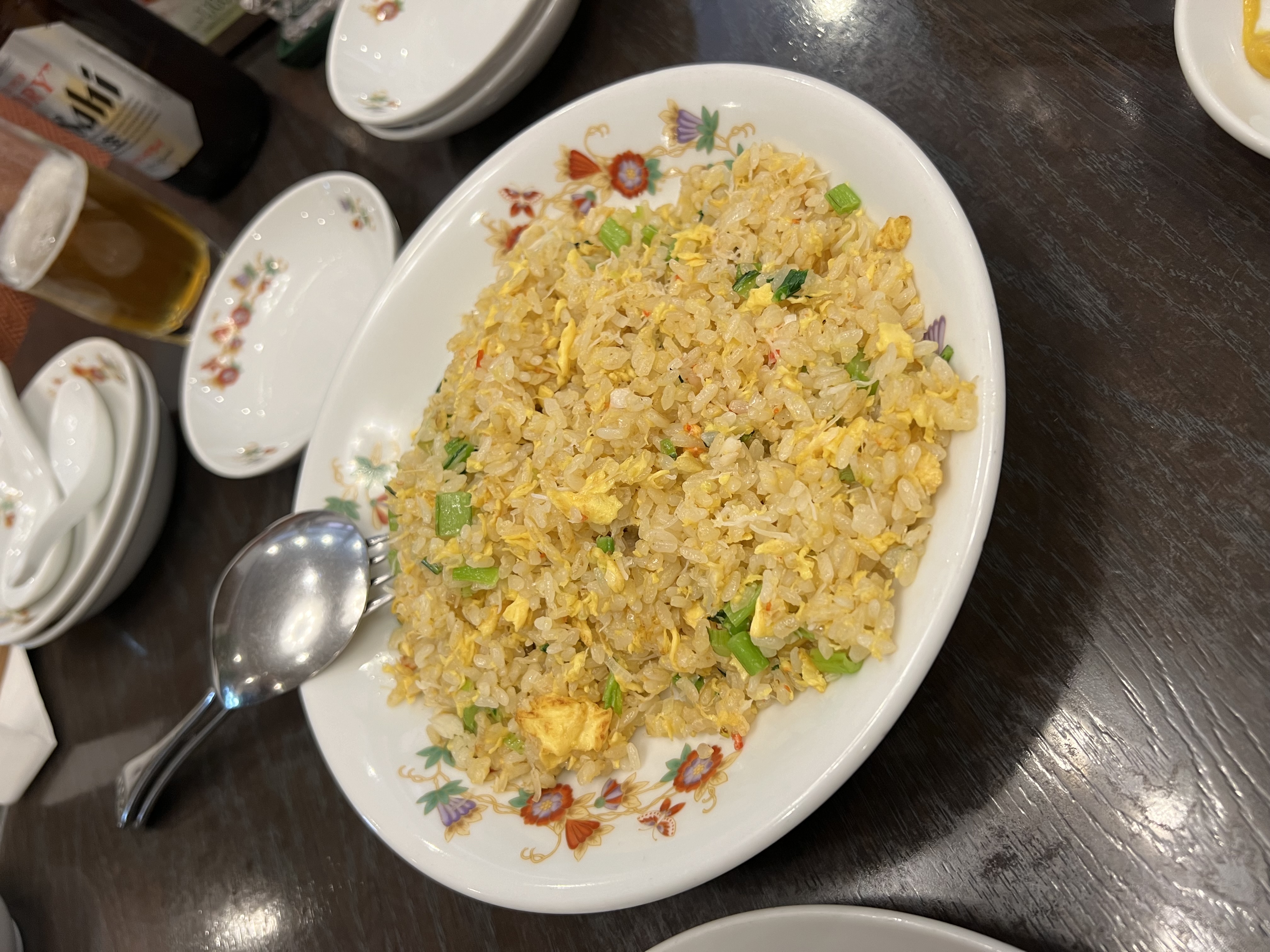 Egg fried rice on an oval floral plate