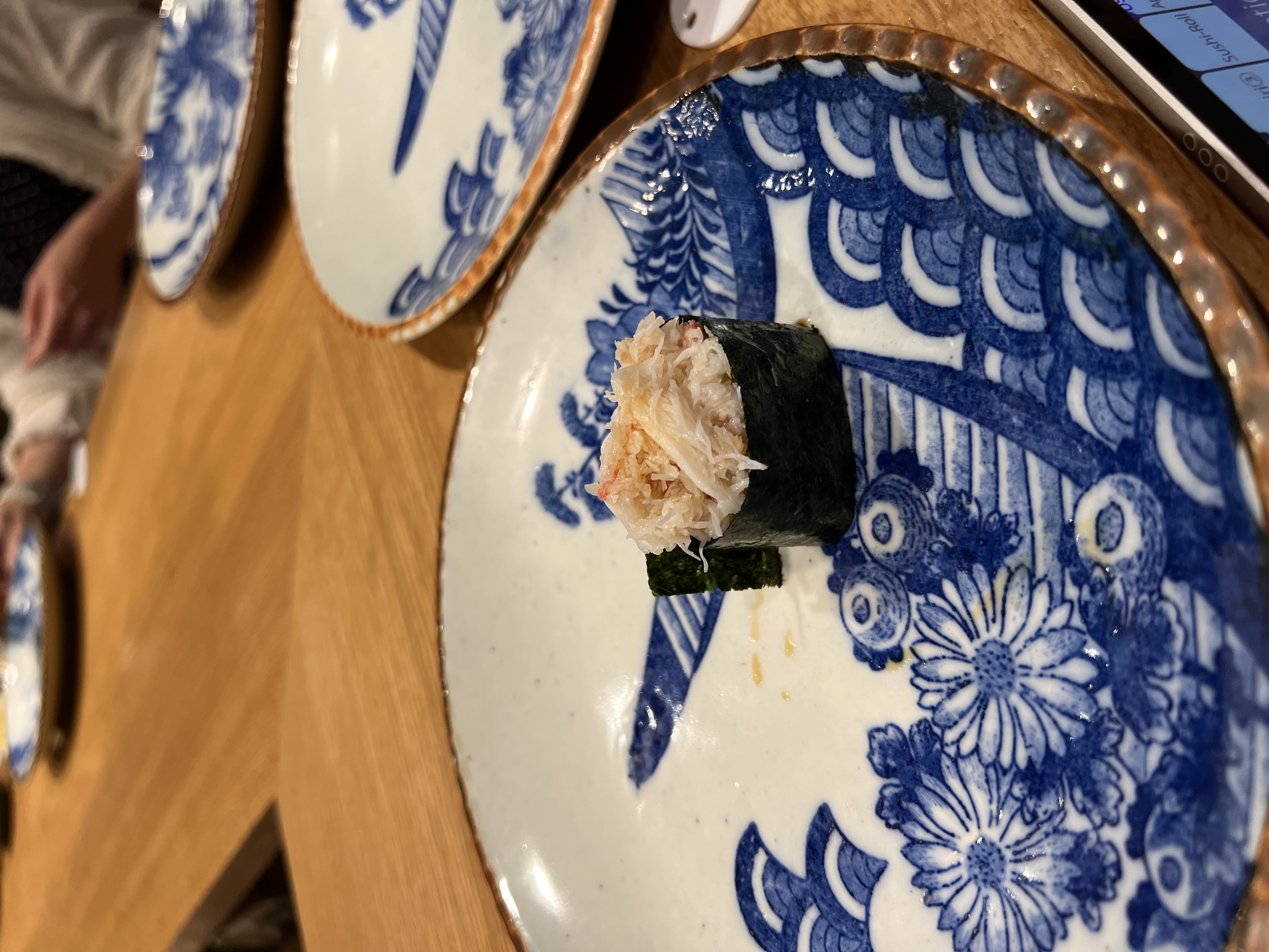 Gunkan maki on a blue and white ceramic plate