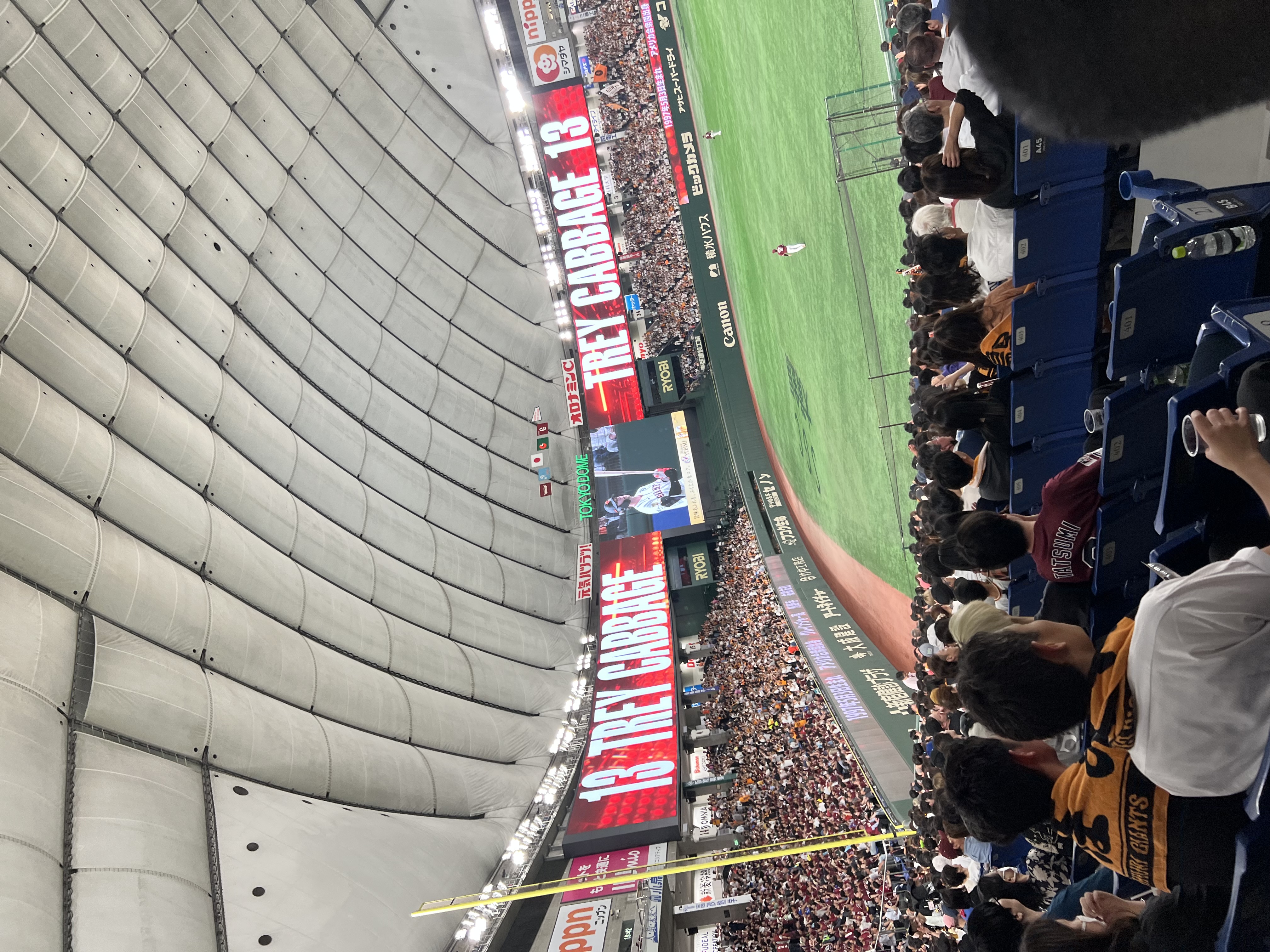 Tokyo Dome scoreboard showing TREY CABBAGE 13 for the Yomiuri Giants