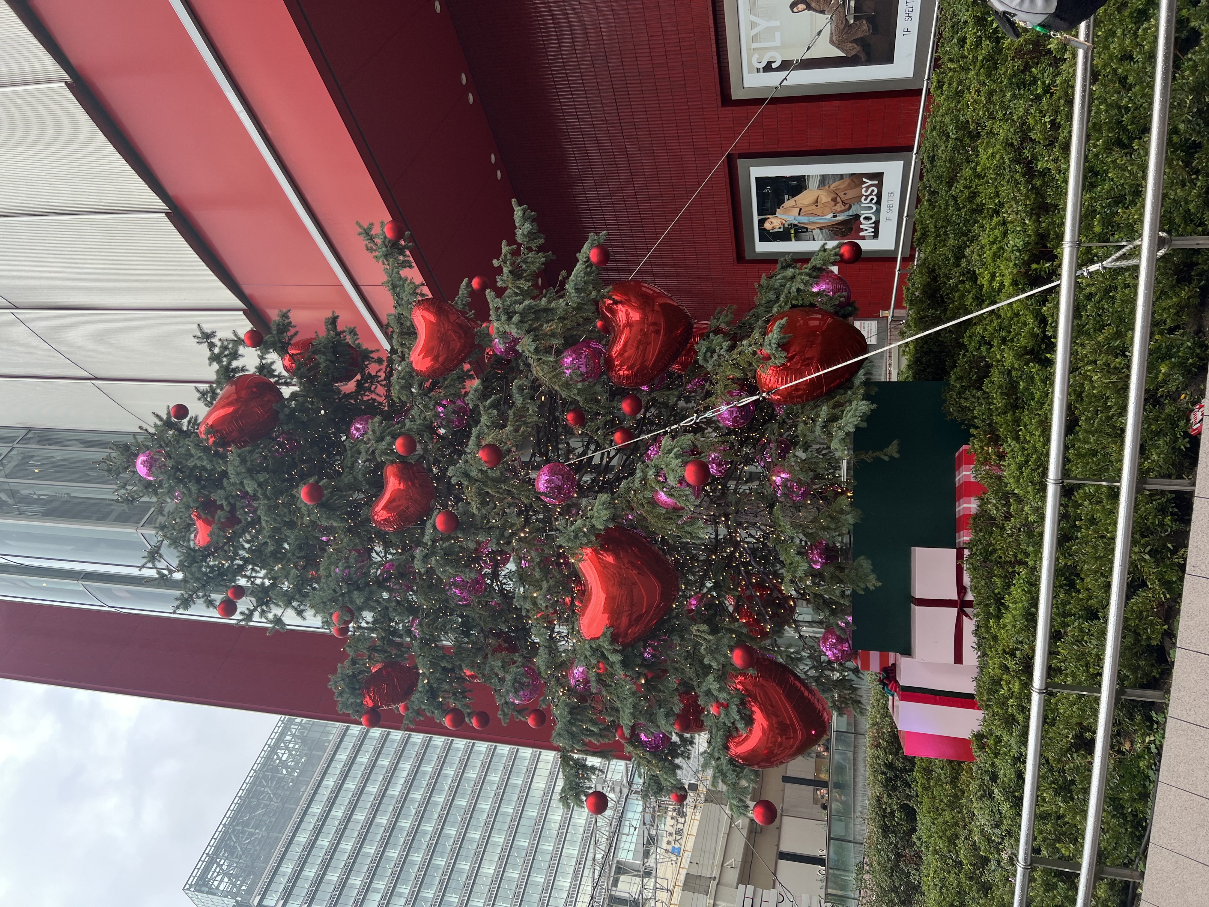 Christmas tree decorated with red heart balloons outside a Tokyo shopping centre