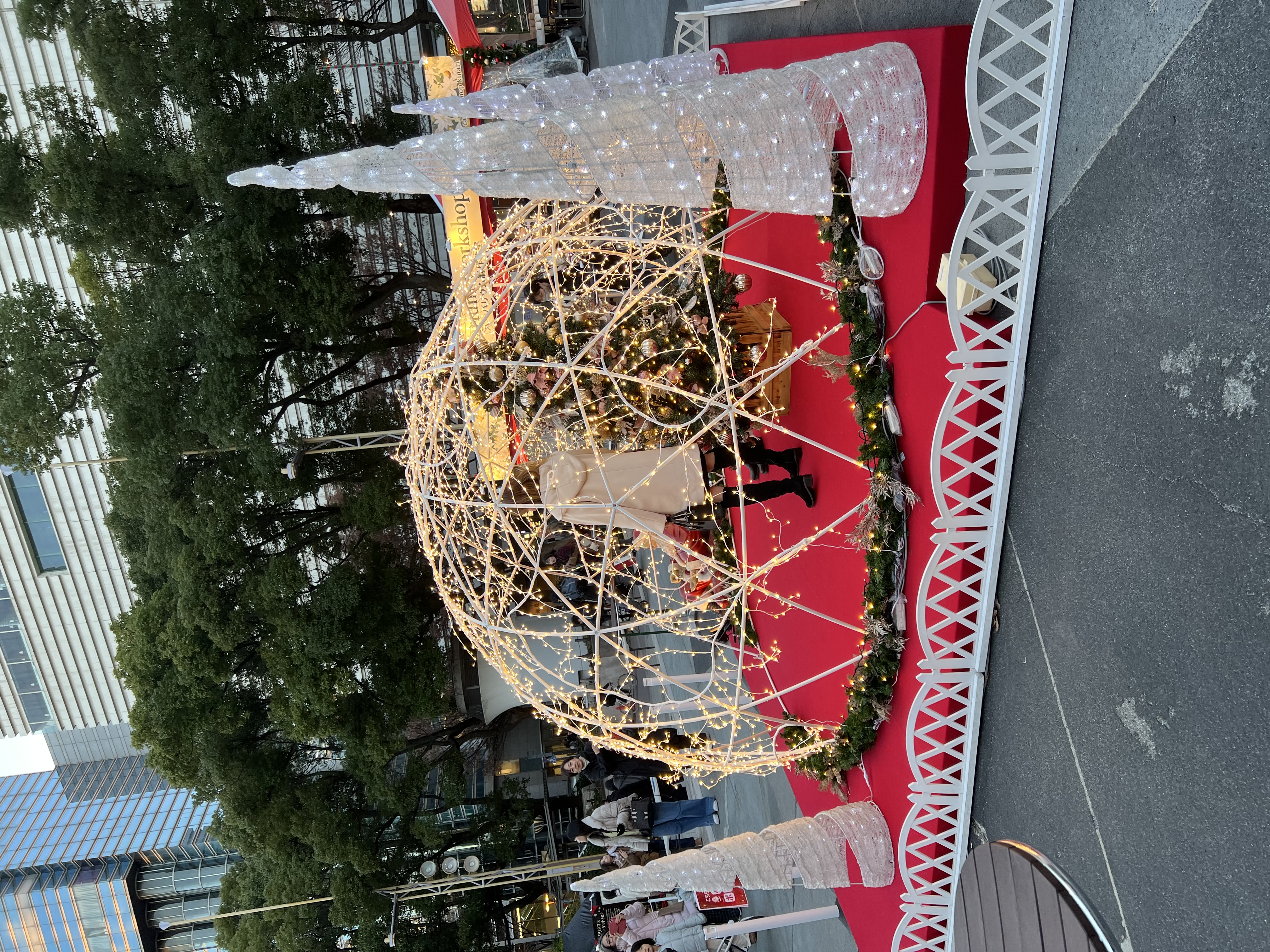Globe-shaped Christmas market centrepiece illuminated at night in Nagoya