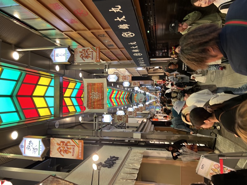 Inside Nishiki Market, Kyoto — covered arcade with food stalls